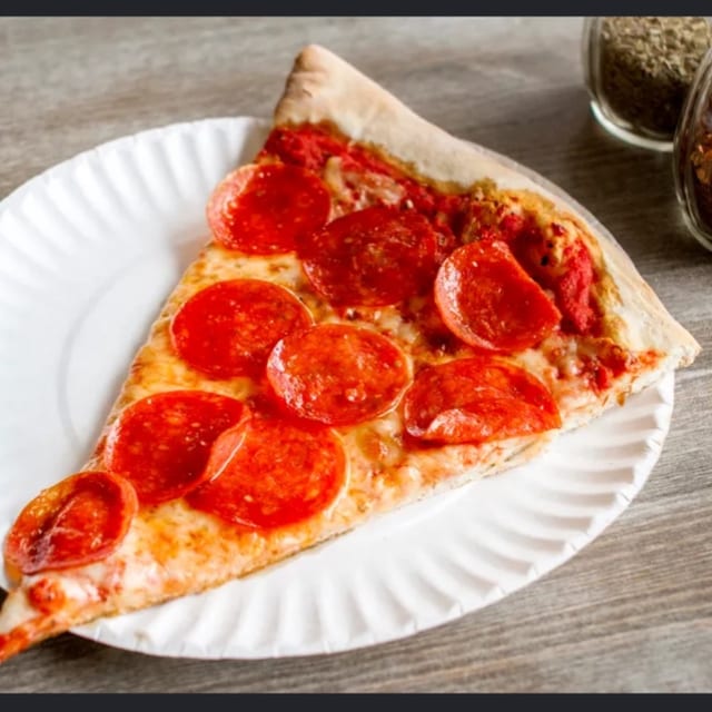 Pizza Slice With Toppings.